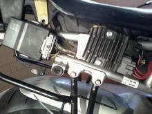 New FH02 rectifier. 
drilled new hole for bottom screw and moved ground wire to back side of plate to the added screw, also cut out part of seat.
