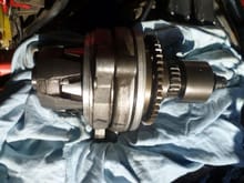 Alternator shaft assembly with new bearings, and new damper fitted ready for reassembly.