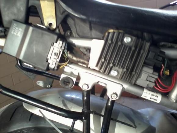 New FH02 rectifier. 
drilled new hole for bottom screw and moved ground wire to back side of plate to the added screw, also cut out part of seat.