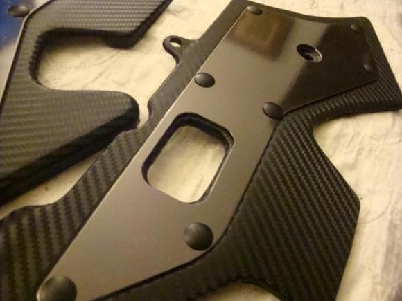 Carbon fiber and Black Chrome... added two more rivets in the middle