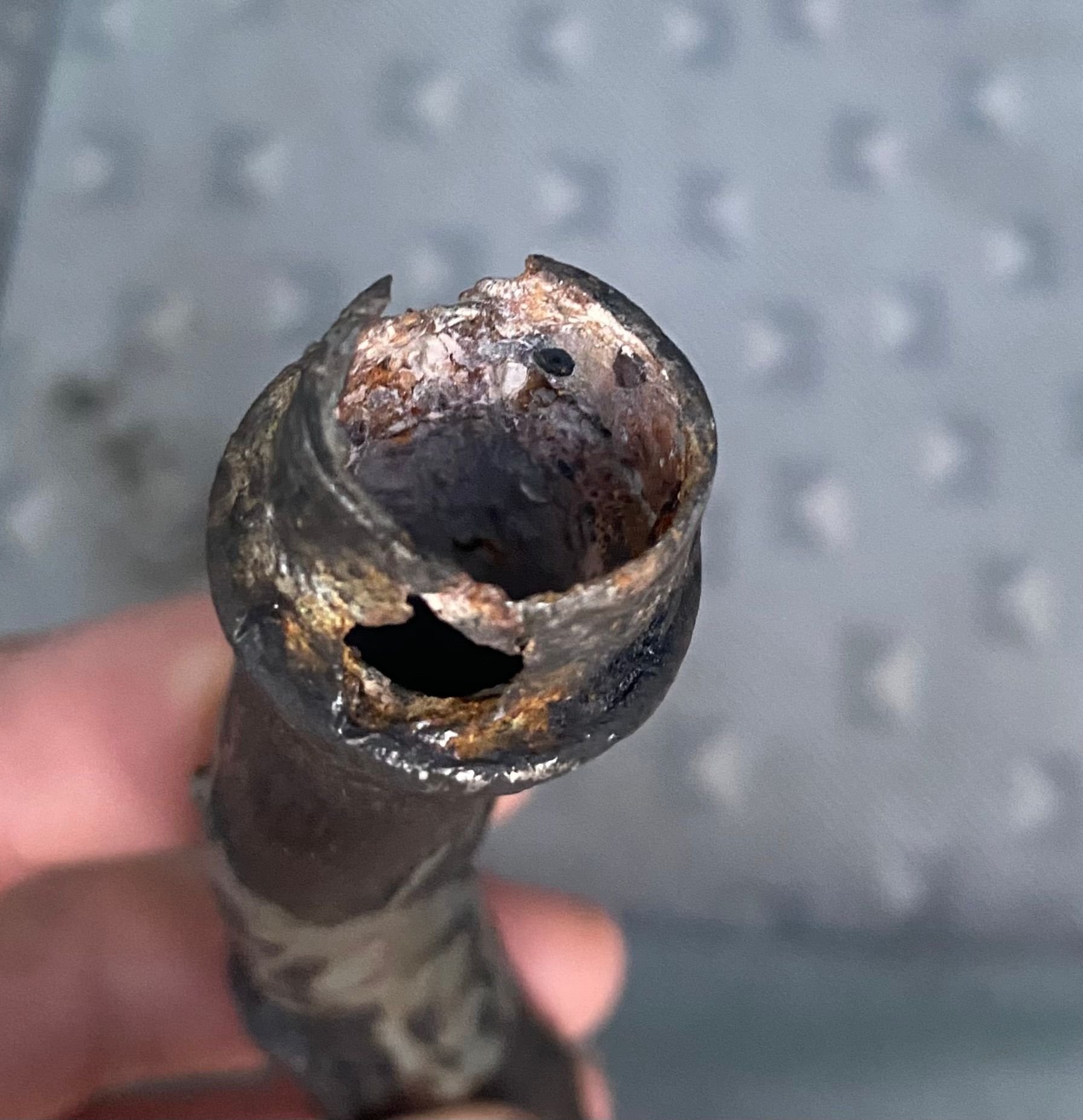 The corroded tip I discovered after pulling it out. 