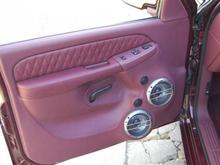 Brand new custom bult leather burgundy door panels with 2 10 inch speakers on both panels. with the unique diamond cut on the trim