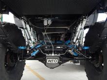 full custom axle trouses with braided brake lines and fox shocks w/res, air dog fuel pump and can see the custom plating underneath in this picture