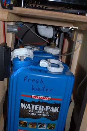 I used two 2 1/2 gallon plastic tanks from ACK.Com adventure suppliers for the gray water and fresh water tanks.