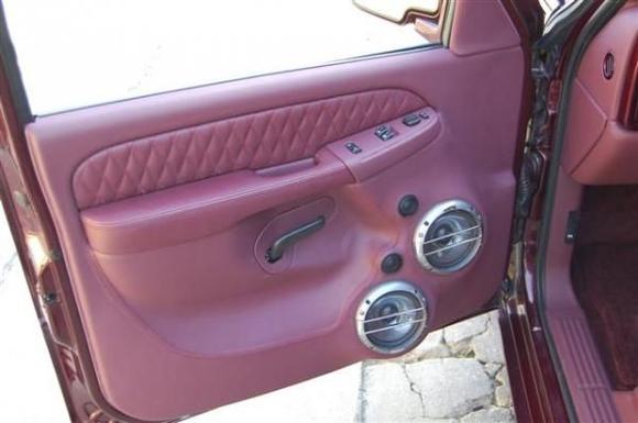 Brand new custom bult leather burgundy door panels with 2 10 inch speakers on both panels. with the unique diamond cut on the trim