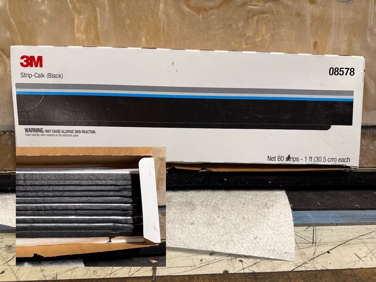 Strip caulk is better than spray glue if you expect to be doing any door & window maintenance.