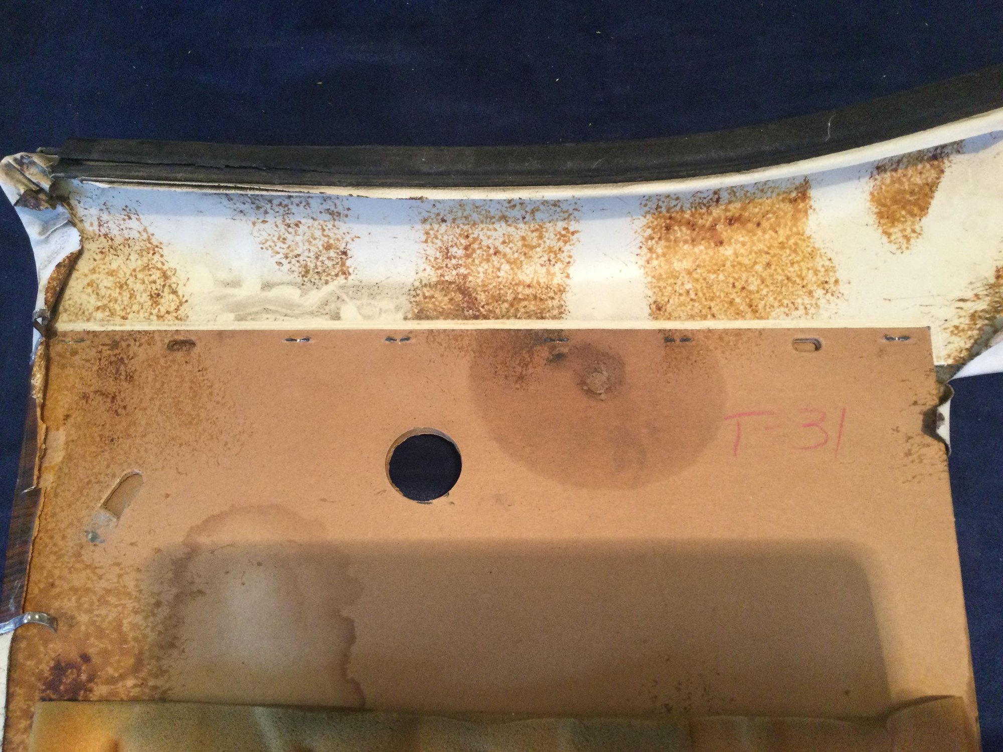 Back side of old panel. Stapled to the hard fiberglass upper