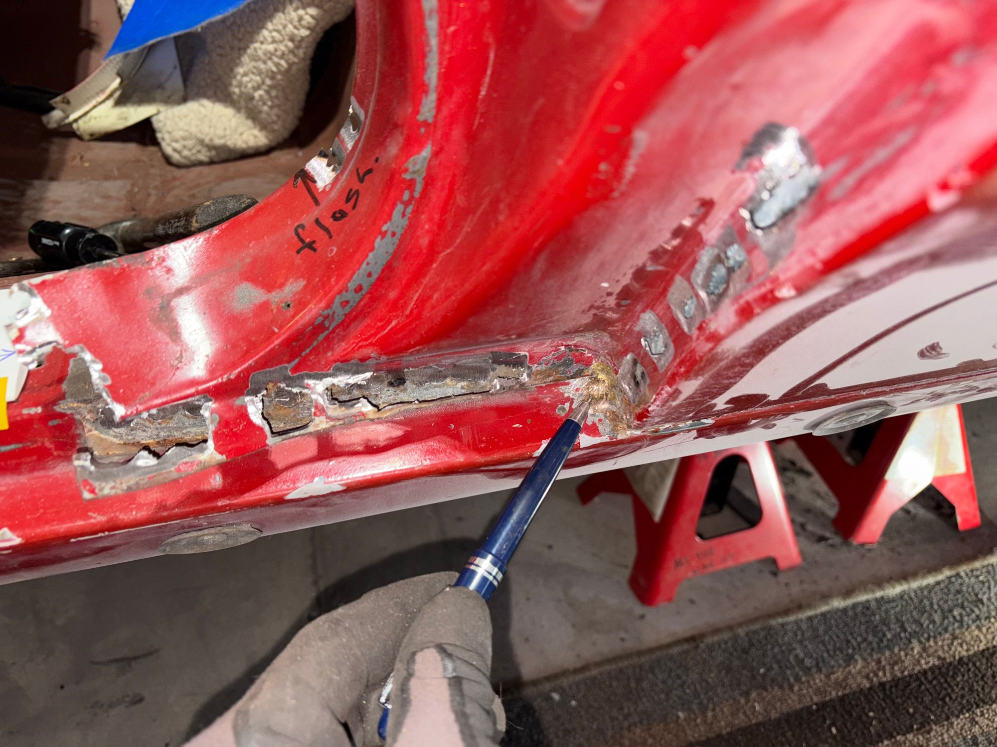 Again I found two spots of brass.  One here in the corner of the door jamb, and another one a t end of rocker panel.
