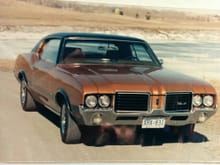 My first car 1972 Cutlass Supreme with factory buckets and console.