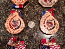 AAU Jr. Track Nationals 2005 - 2007 medals.  The medals were for the High Jump and Pentathlon each year.  The copper colored medals were for 4th - 10th place finishes.  The bronze medal in the upper right was a 3rd place in the Pentathlon in 2007.  Generally there were 35 - 40 competitors form across the country who had placed in the Top 3 of their respective Regions.