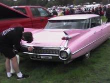 A flat top, my favorite style, and the only make, model and year of any pink car that a straight guy could drive. :)