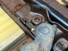 This is the troublesome bolt holding the latches and the header bow.  I sprayed a liberal amount of PB Blaster but could not break it loose.