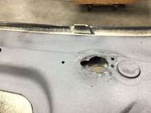 Probably going to cut this out. Would be nice if I could find a picture of a hood hole without the bracket to use for reference. I'll probably just center a hole with the fiberglass hole and make it just big enough to get the pin through.