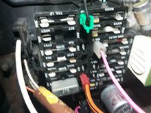 Fuse box may be showing upside down. The mystery can connector and it's pink wires are just visible at the center bottom (or center top). 