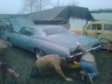 My friend Brent and the previous owner of the car loading the Caprice onto a trailer.