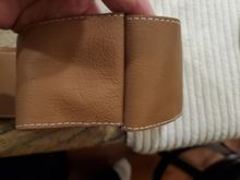 Belt seem from the exposed side with running stitches.