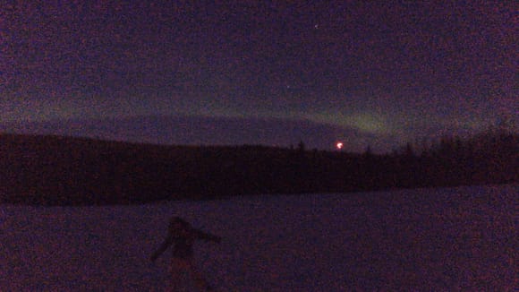 Here’s me at a lodge where you can see the Northern Lights in the background. This photo was taken with an iPhone. I had to download an app in order to get a pic of the Northern Lights