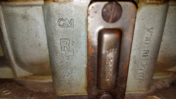 Carb 1 - Stamp below the "RP" is 7033744.  I'm guessing this is the identifying stamp.