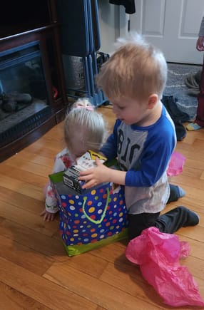 Big brother Ollie just had to help open every gift!