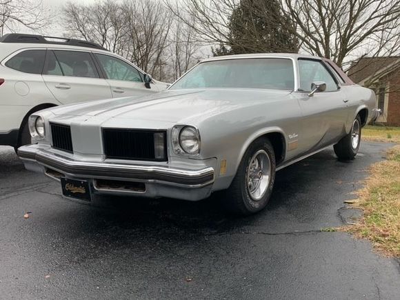 Upgrades to be done:  Install floor shifter and console from 1974 Cutlass Salon 4 door. (Yes they came out of a 4 door) Bucket seats from I think a 1977 Cutlass. Reupholster the seats, console dashboard and vinyl top in Ox-Blood canvas.  Recolor all the molding. Install sport mirrors and a real stereo.