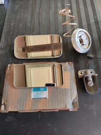 Upper Left - used "Oldsmobile" vanity mirror slide clip type. Has blemishes. $15.
Lower left - Nos push lock style mirror. Part # 480890. Very slight blemishes on outer edge. $45.
Upper Right - 70-72 used OEM dome light bezel with wires. $15.
Lower Right - 70-72 OEM used under hood lamp. $10.
