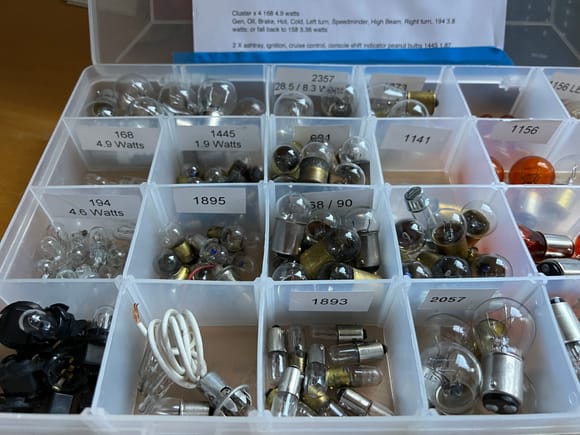 Bulbs labeled and organized so they're easy to find when you need 'em. Notes to me on the lid so I don't have to look it up every time. 