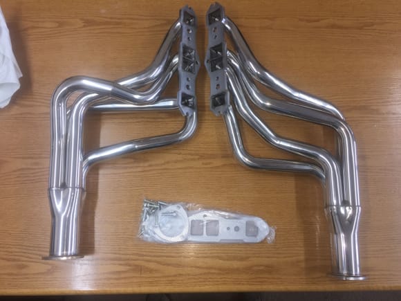 The passenger side header is about 4" shorter than the other and the shortest pipe is 28" from head to outlet and the longest is 39".  Comes with foil covered paper gaskets and bolts that you can use on another project.