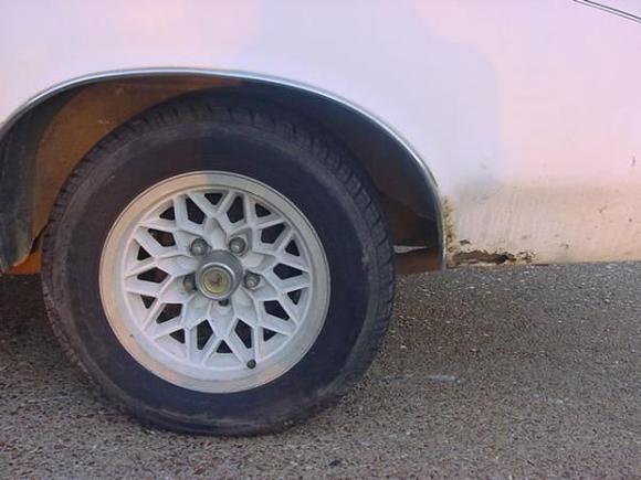 driver rwheel-rust at the back and front of this quarter.  I'll try and patch it.