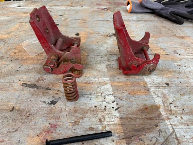 With spring out, I took a cutoff disk and cut the hinge pin in a couple places nd drove the pin parts out.