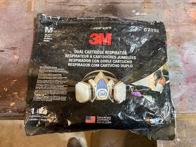 A good respirator for auto painting is the 3M charcoal filter that gets most of the organic vapors.  OK to use if you also have good room ventilation.  Keep it sealed up in the bag if not using, as the filters will wear out quickly.  Some paints, this is not adequate.  You will need a supplied air respirator.