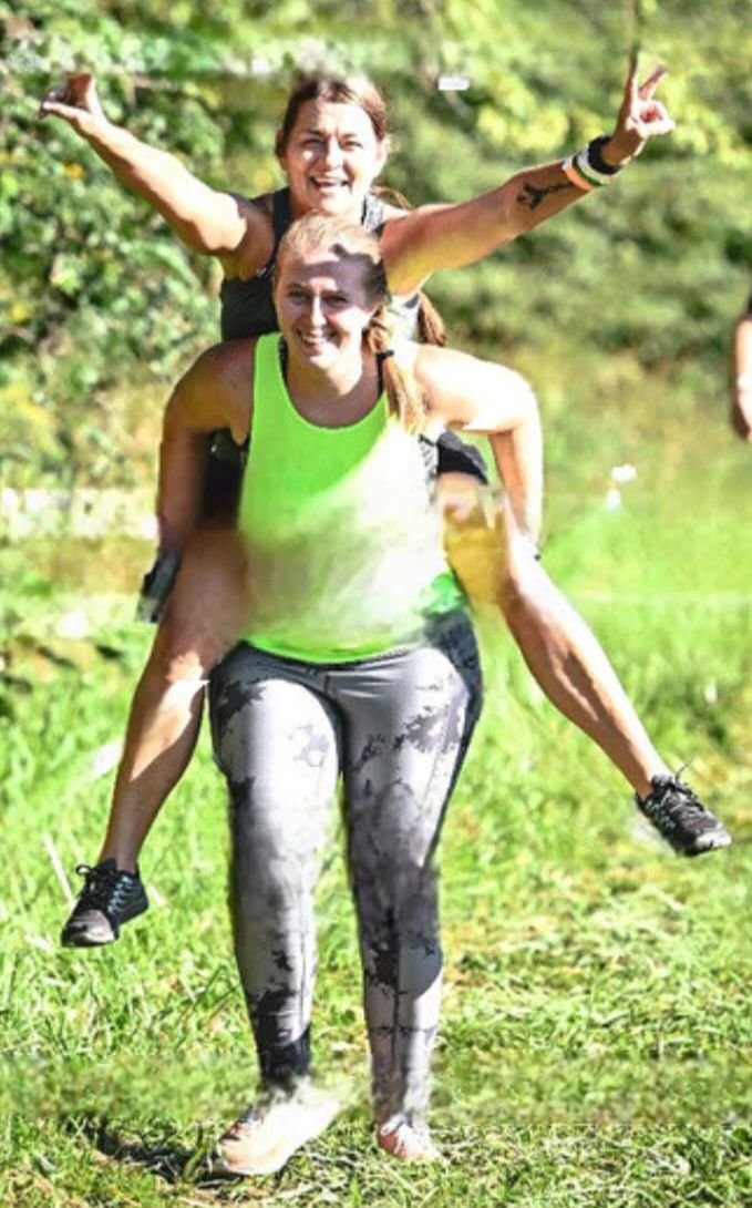 Dawn pulled this pic off the event website.  The partner carry.  Dawn could not carry my daughter, but my daughter did not have a problem carrying her!