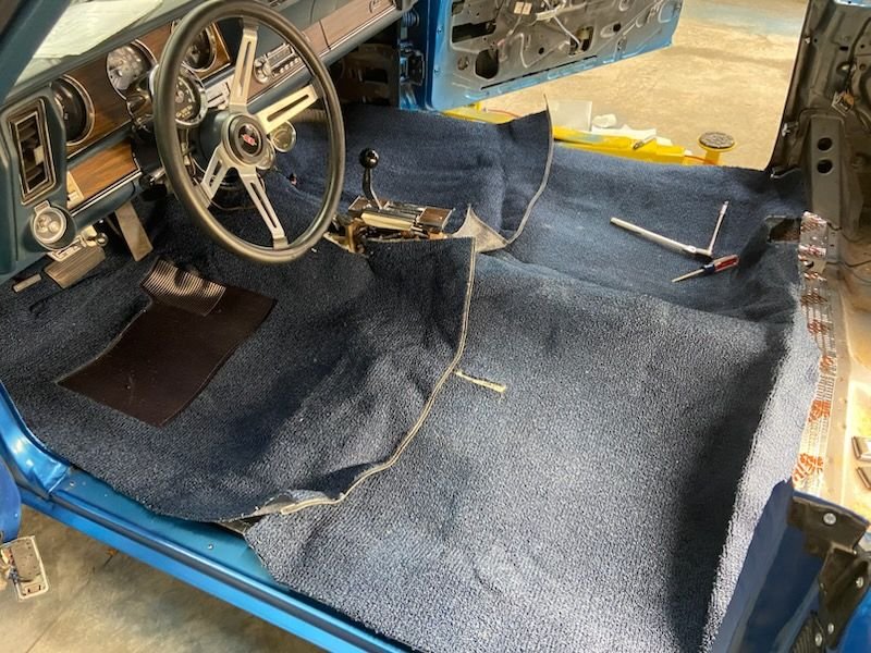 First, I laid the new carpet over the old original carpet and when I thought it was close, I cut the same spots on the new compared to the old console cuts. I then decided that it might not be the right way. 