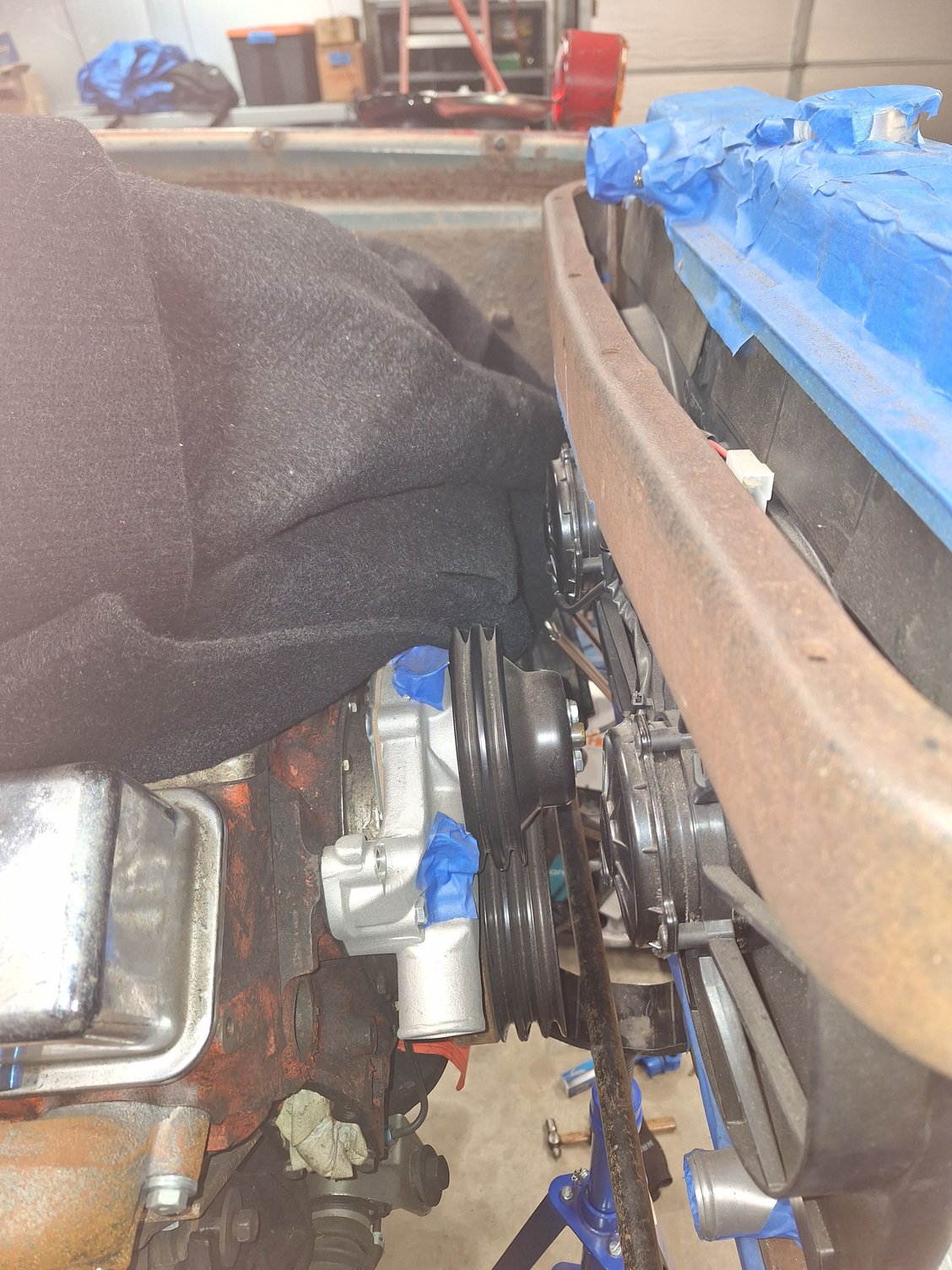 Core support, water pump-fan clearance.