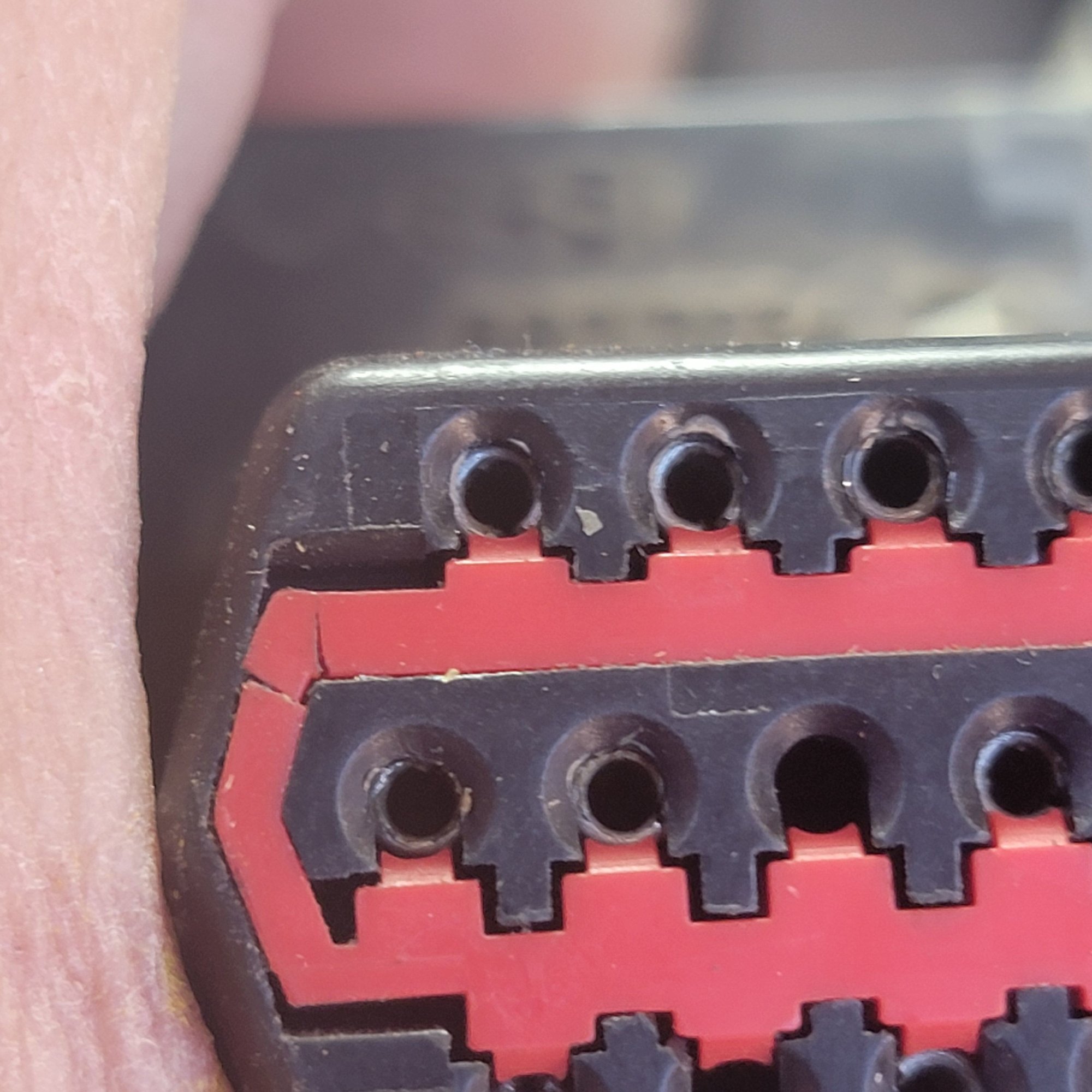 Spread pins and cracked orange pin lock thing