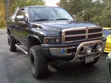 new ss bullbar ...had to weld custom bracket due to bodylift... notice the harbor  frieght 6" kc knockoffs...(thay actually changed the harbor frieght lights to make them completly like the kc's except the 55w versus 100watt bulbs)....but at $15 versus $109 I really dont care about the added power right now...