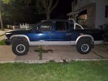 Ditched the topper & went with a fiberglass tonneau cover. Had a roll bar that I really liked the look of, but it would work with the cover. So more modifications & customizing come