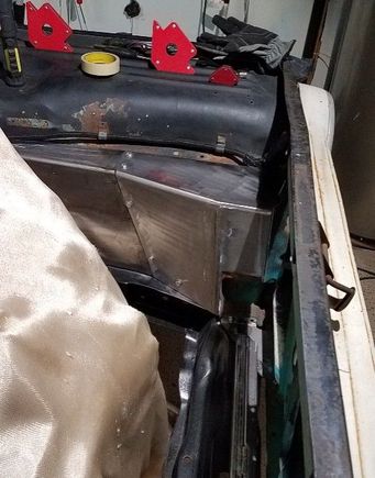 Without the radiator. It fits pretty good with whats left of the core support. 