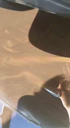 Glittery oil. Not sure if from the timing chain hitting metal or from a bad bearing 