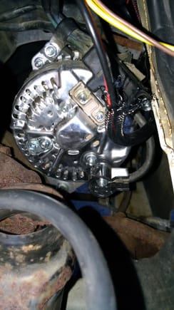 The lone black wire is connected to the alternator ground lug.
