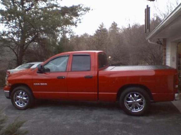 2005 ram 1500 qc, my first v8 and my first lowering kit. this pic was right after the rear end flip kit was instailed before adjustment. 5.7L hemi, cold air, super 40's,jet chip low tem therm, ''first time i ever acualy bought one'', and yes same old ass wheels, witch i upraded two weeks later.