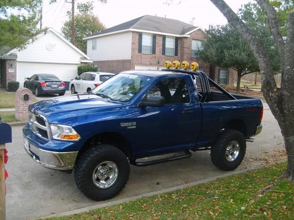 6 inch Superlift lift kit, 37x12.50 Pro Comp mud terrains, 17x8 SLT Muscle Mags polished slot mag wheels, double tube roll bar by Sterling Equipment, 4 KC Daylighter off road lights with smiley covers, Line X spray on bedliner, Big Country step bars,  Mopar cold air intake, Genuine Mopar reproduction 1979-80 "Power Wagon 150" fender emblem decals