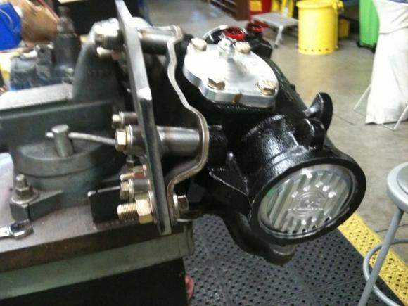 New steering box 3/8'' plate bolted to the frame with 4 9/16'' bolts and threw bolted to the factory mounting bracket with 4 7/16'' bolts.  The stand offs are pressed on the bracket closest to the steering box, and welded to the 3/8'' plate. About 45 hours start to finish.