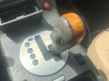 The gear selector is stuck and won’t go into gear. Even if I use the shift lock key. I threw my phone to the passenger side and it hit the gear selector while driving and jammed it in the position it’s in now. Can anybody tell me what I need to do to correct this problem. As far as the part name and the actual name for the part I need. I’m in a 03 g35 base with leather