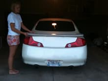 My girl holding the new spoiler on to see how she looks... Getting painted and installed soon.