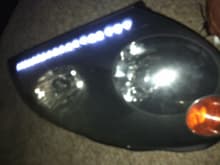 baked, pulled apart, inside headlight bezel painted black with 18 5mm 3v super bright white LEDs ran in series of four