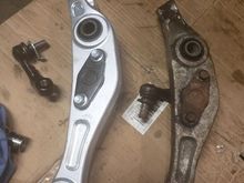 New Lower control arm with bushings and ball joints pressed in place & stabilizer bar link.