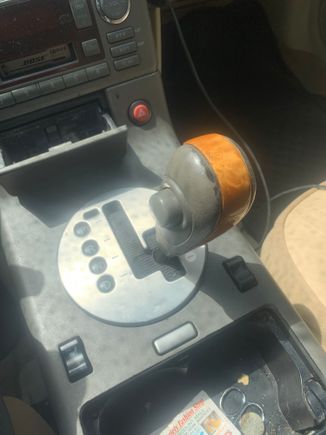 The gear selector is stuck and won’t go into gear. Even if I use the shift lock key. I threw my phone to the passenger side and it hit the gear selector while driving and jammed it in the position it’s in now. Can anybody tell me what I need to do to correct this problem. As far as the part name and the actual name for the part I need. I’m in a 03 g35 base with leather