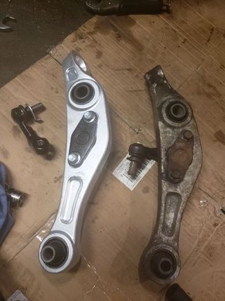New Lower control arm with bushings and ball joints pressed in place & stabilizer bar link.