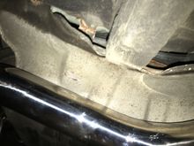 S-pipe pushed against the heat shield