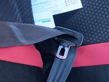 The passenger side retractor's spring is sprung.